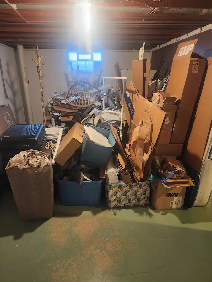 Roll-off dumpster container at job site for 6 Yard Dumpster Rental in Cheboygan